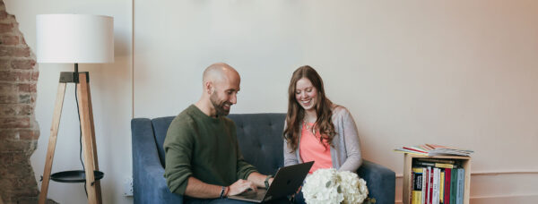 Two Metric employees review their tasks for the day.